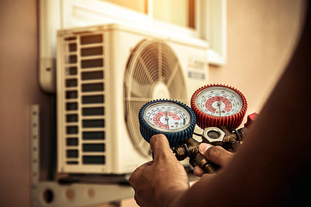 Professional Air Conditioning Service technician working in New Athens, IL